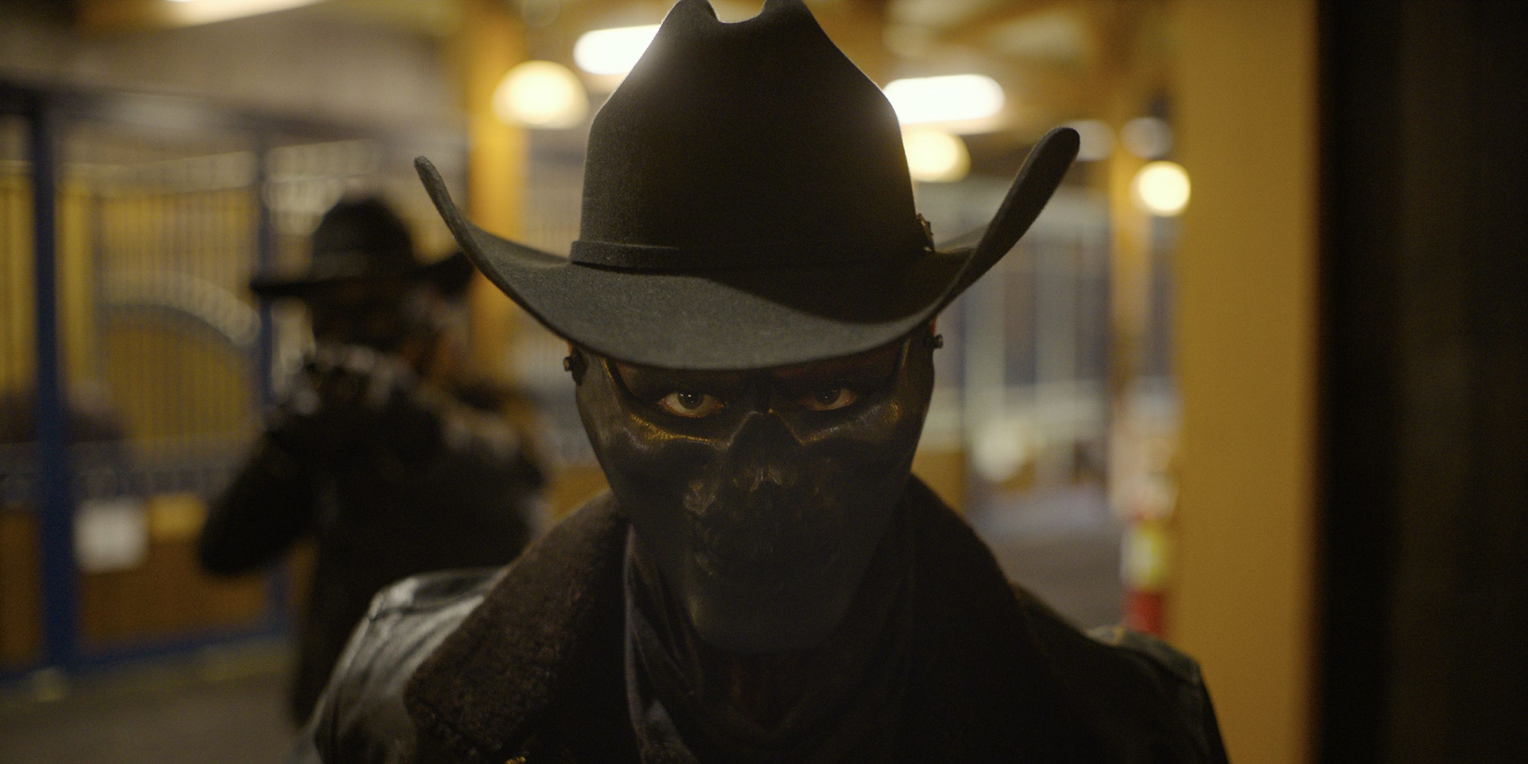 A man in a mask and cowboy hat in The Forever Purge