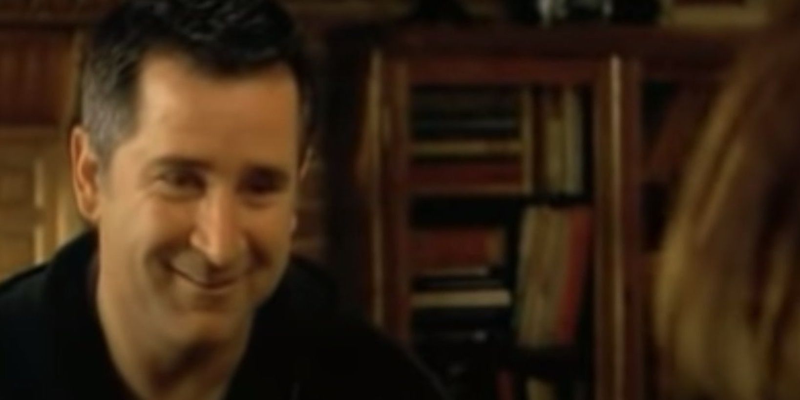 Anthony Lapaglia laughing and looking off camera in The Guys.