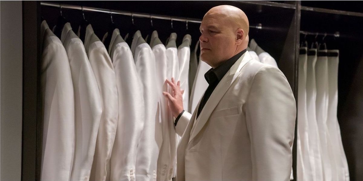 The Kingpin runs a hand over his white suits