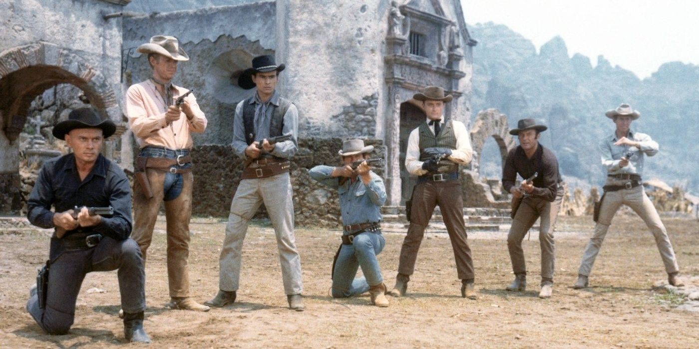 The cast of The Magnificent Seven outside with guns