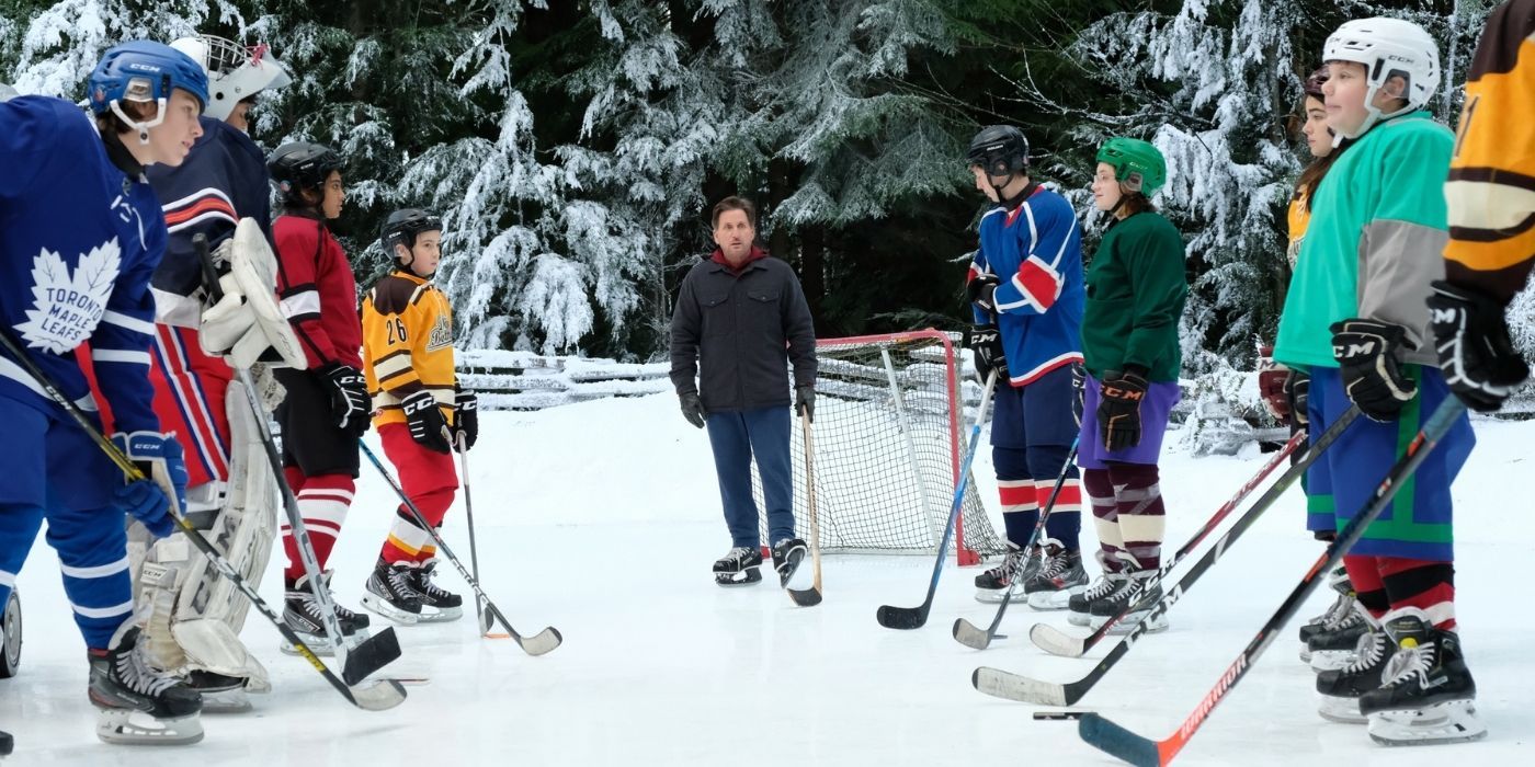 Coach Bombay and the team on an ice pond