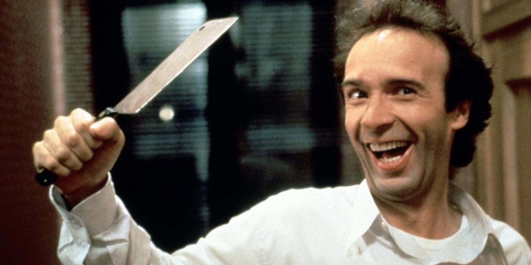 Roberto Benigni holds knife in The Monster