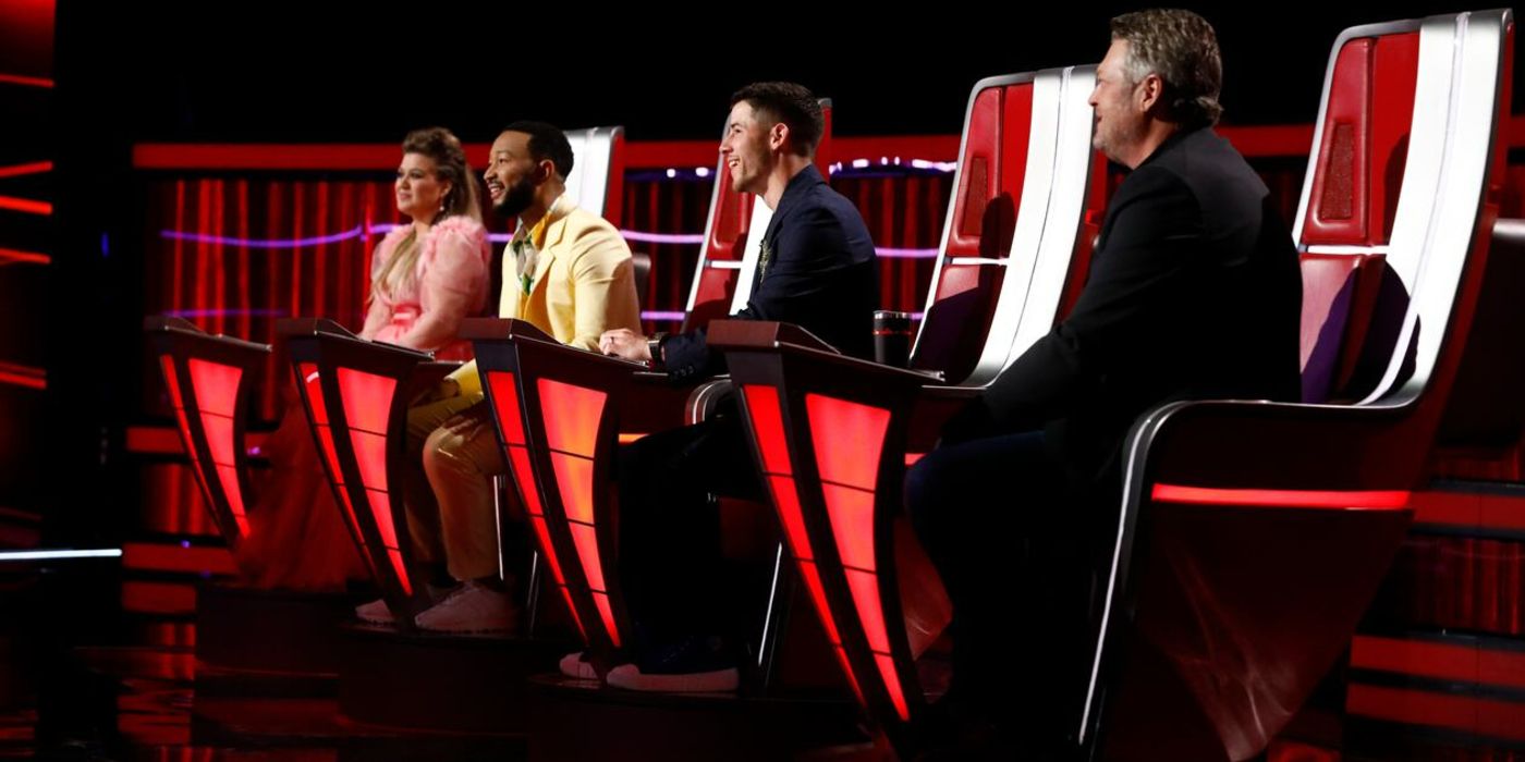 The Voice judges in their chairs with Kelly Clarkson, John Legend, Nick Jonas and Blake Shelton