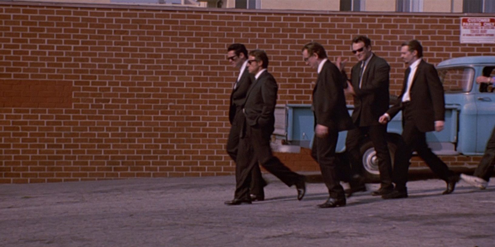The guys walk through the parking lot in Reservoir Dogs