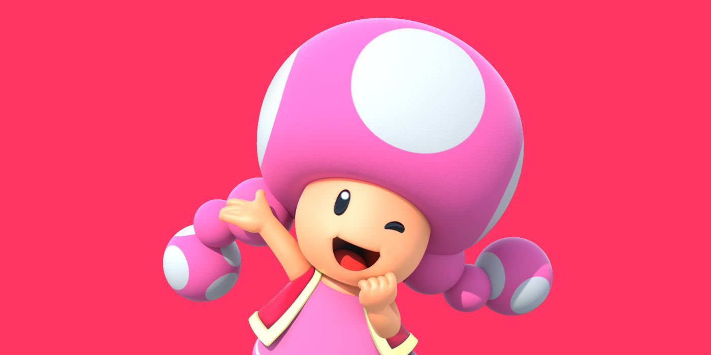 Toadette smiles on a red background
