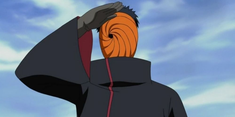 Tobi Saluting in Naruto with a face thatlooks like an orange spiral
