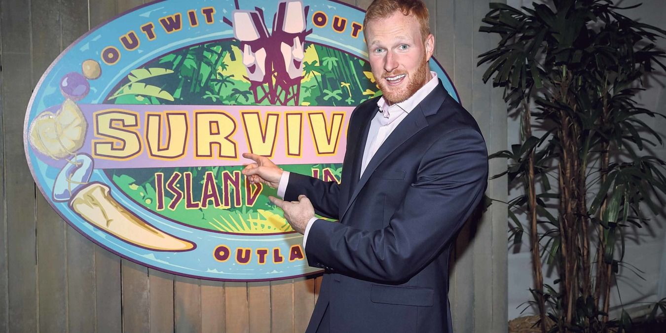 Tommy Sheehan in front of Island of the Idols sign after final tribal council