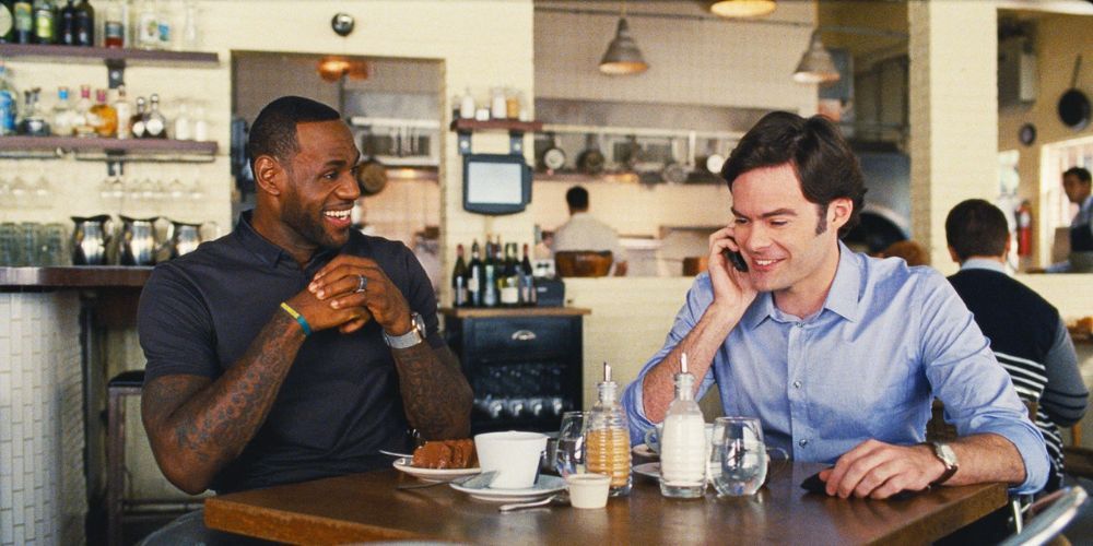 LeBron James laughs with Bill Hader at dinner in Trainwreck
