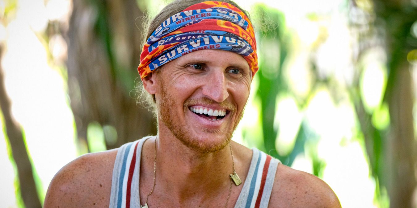 Tyson at camp, laughing with the Survivor buff on his head