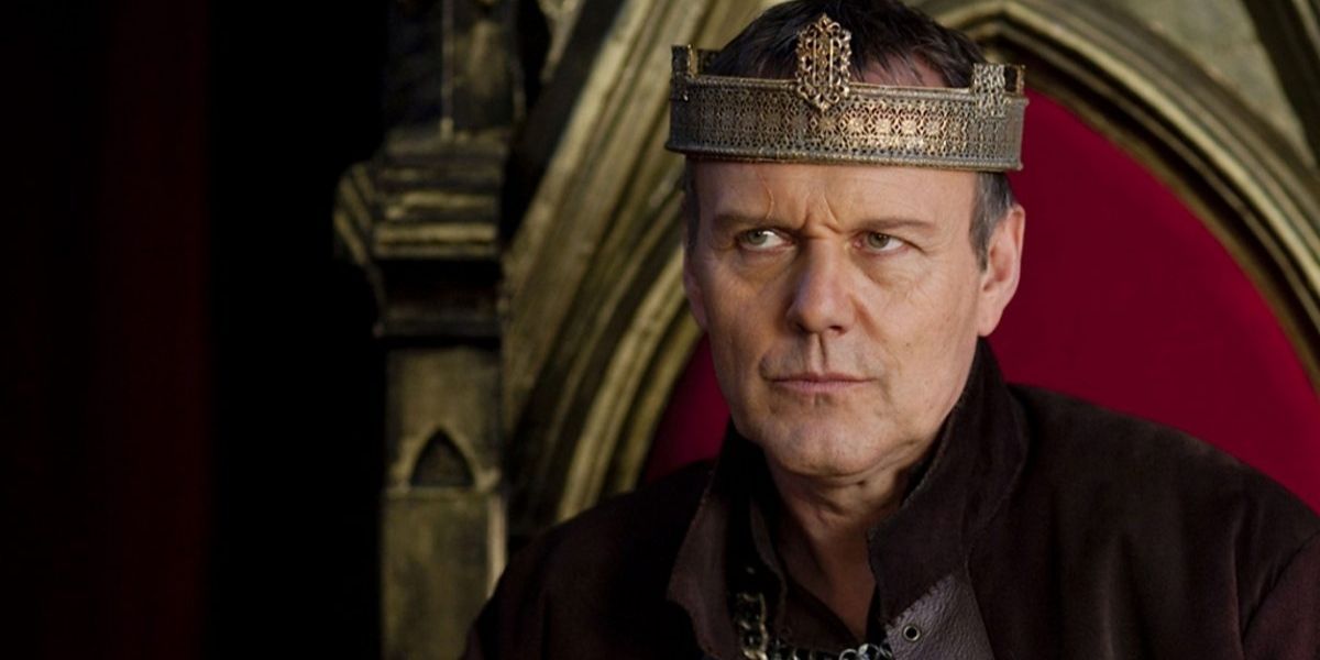 King Uther Pendragon sitting in Camelot's throne