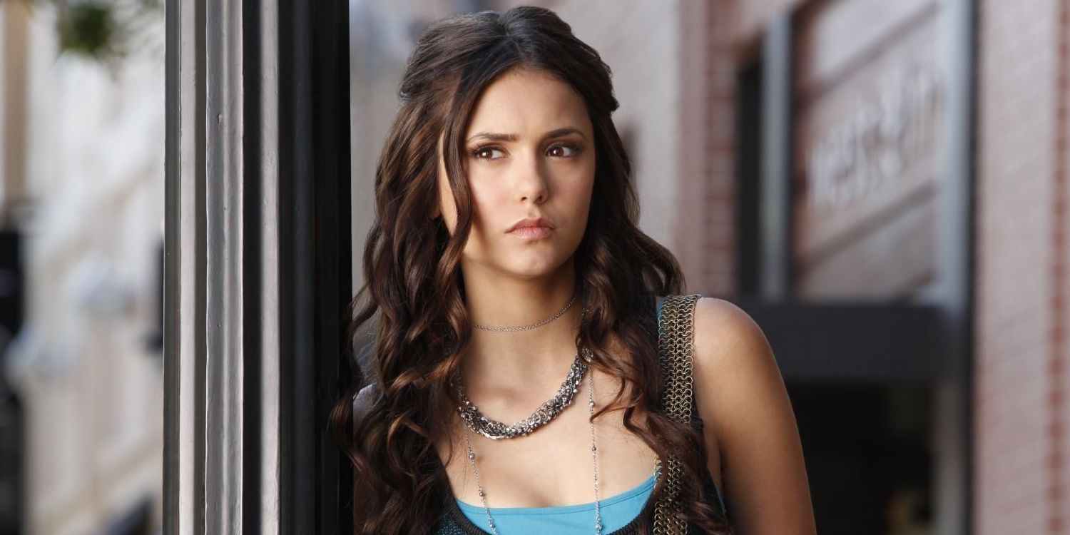 Katherine leaning against a doorway in The Vampire Diaries