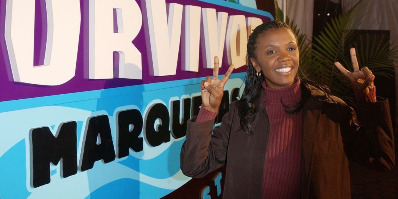 Vecepia Towery in front of the sign after winning Survivor