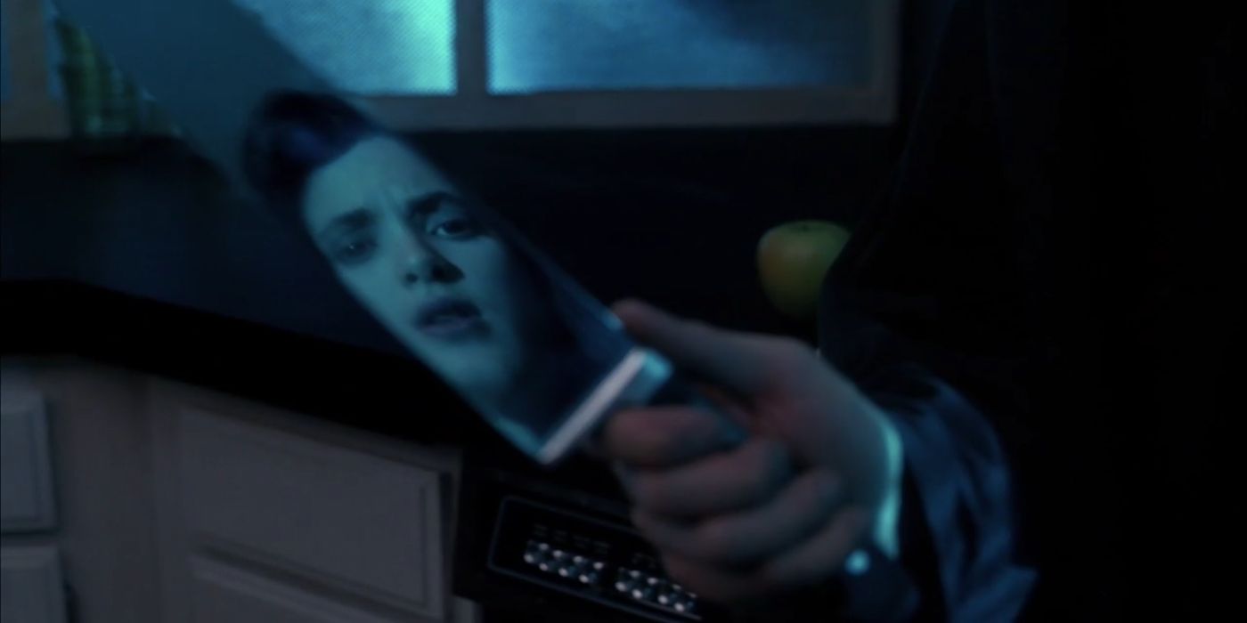 Veronica's reflection in J.D.'s Knife in Heathers