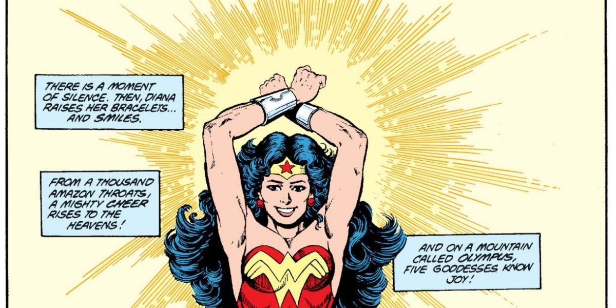 Wonder Woman lifts her arms and puts her bracelets together