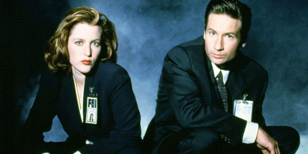 Scully and Mulder posing in front of fog from The X Files