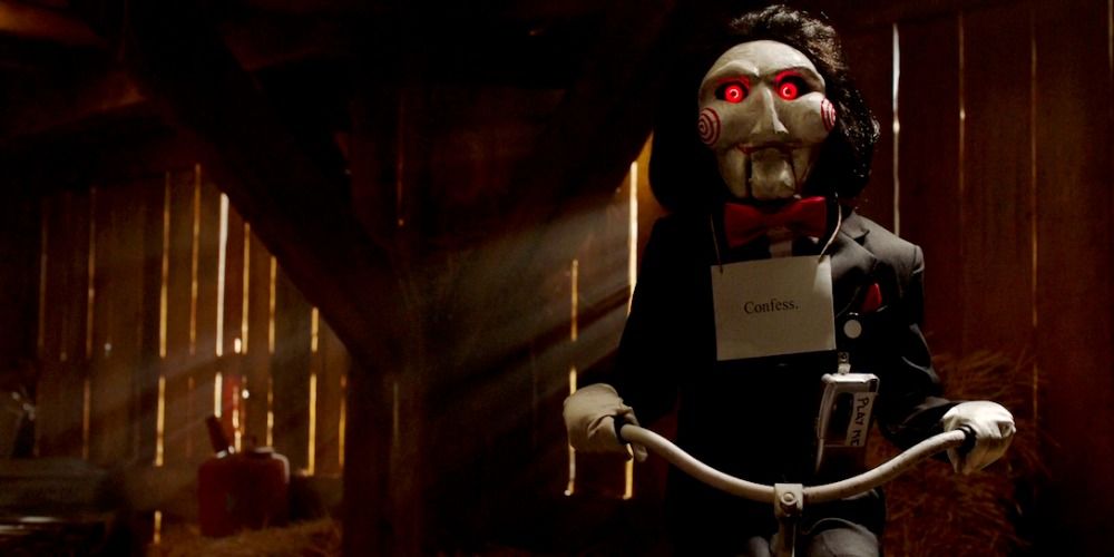 Scene from Saw with red-eyed doll riding a trike
