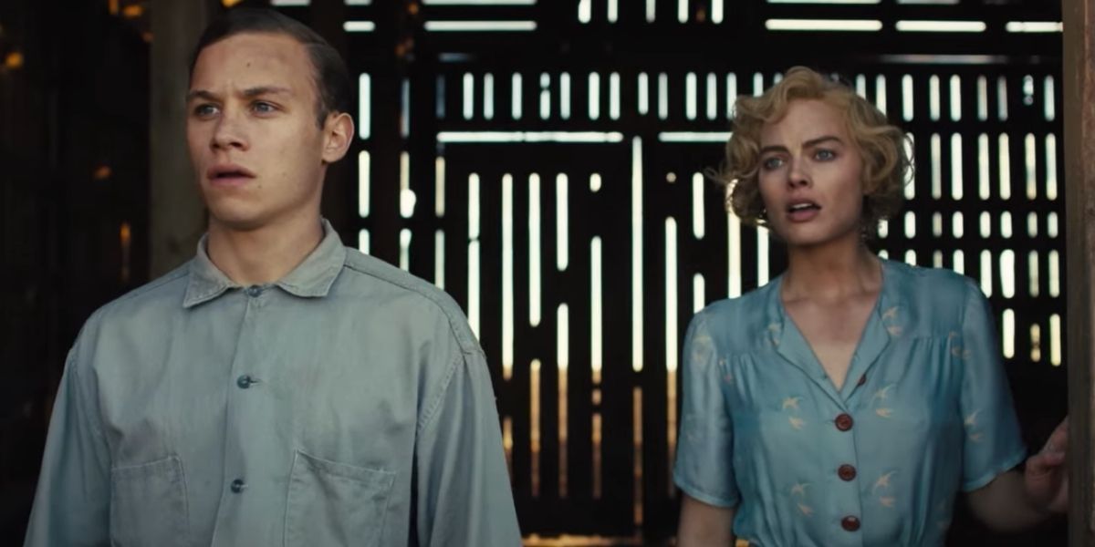 finn cole and margot robbie stare out ot barn in dreamland 