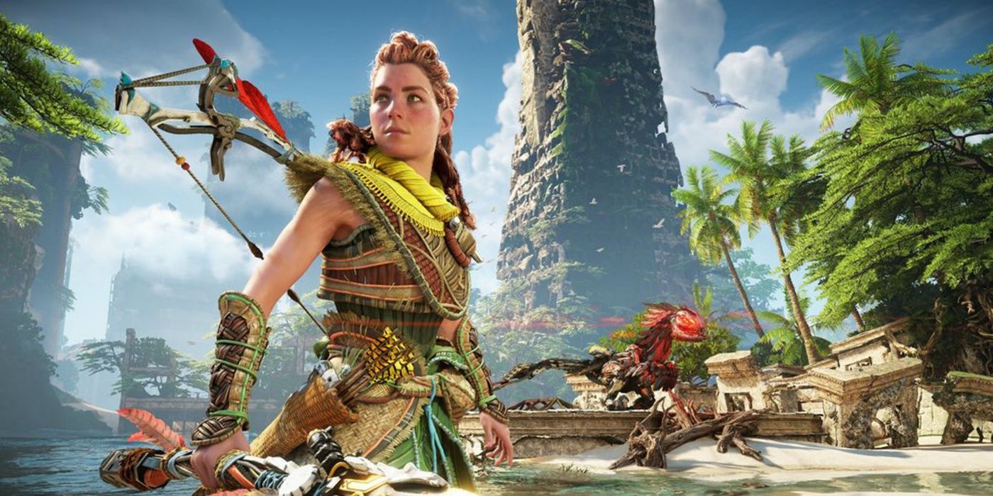 A photo of Aloy standing in front of the ruins and greenery in Horizon Forbidden West.
