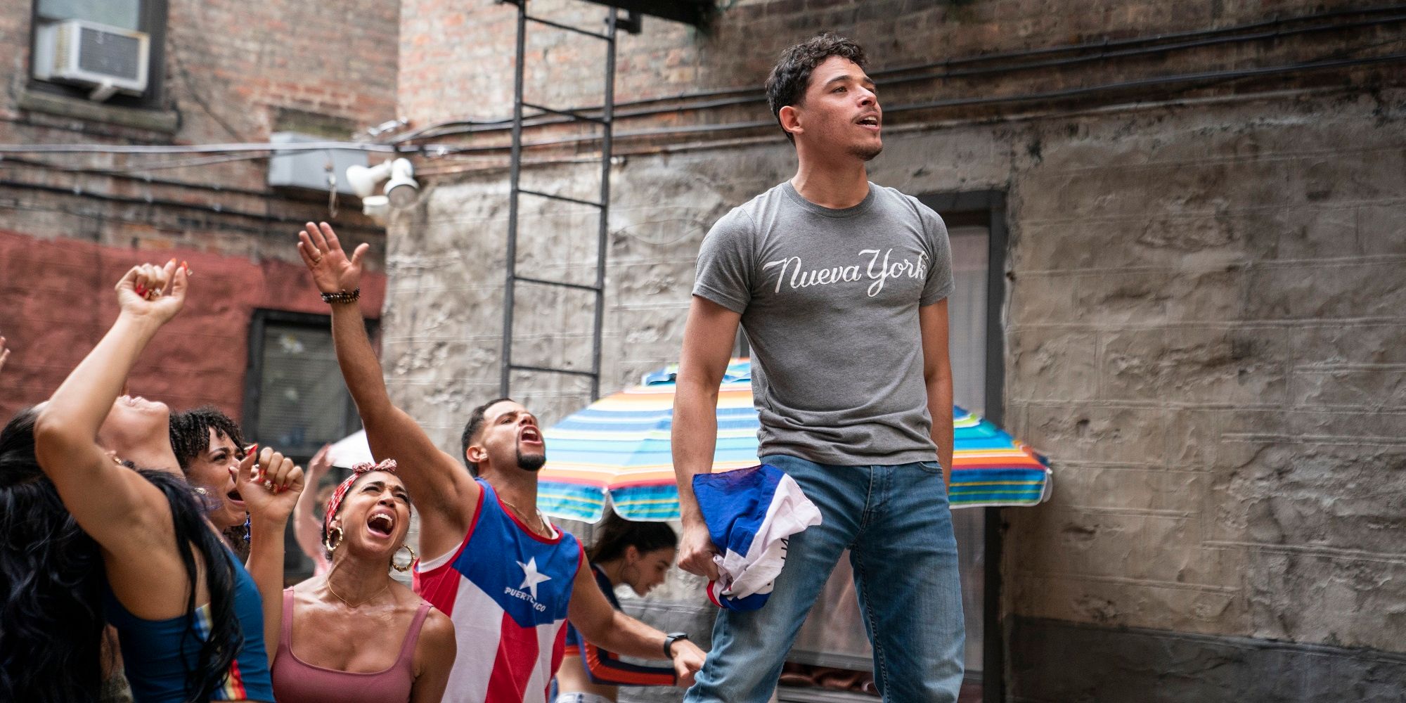 Usnavi sings during a block party in In The Heights