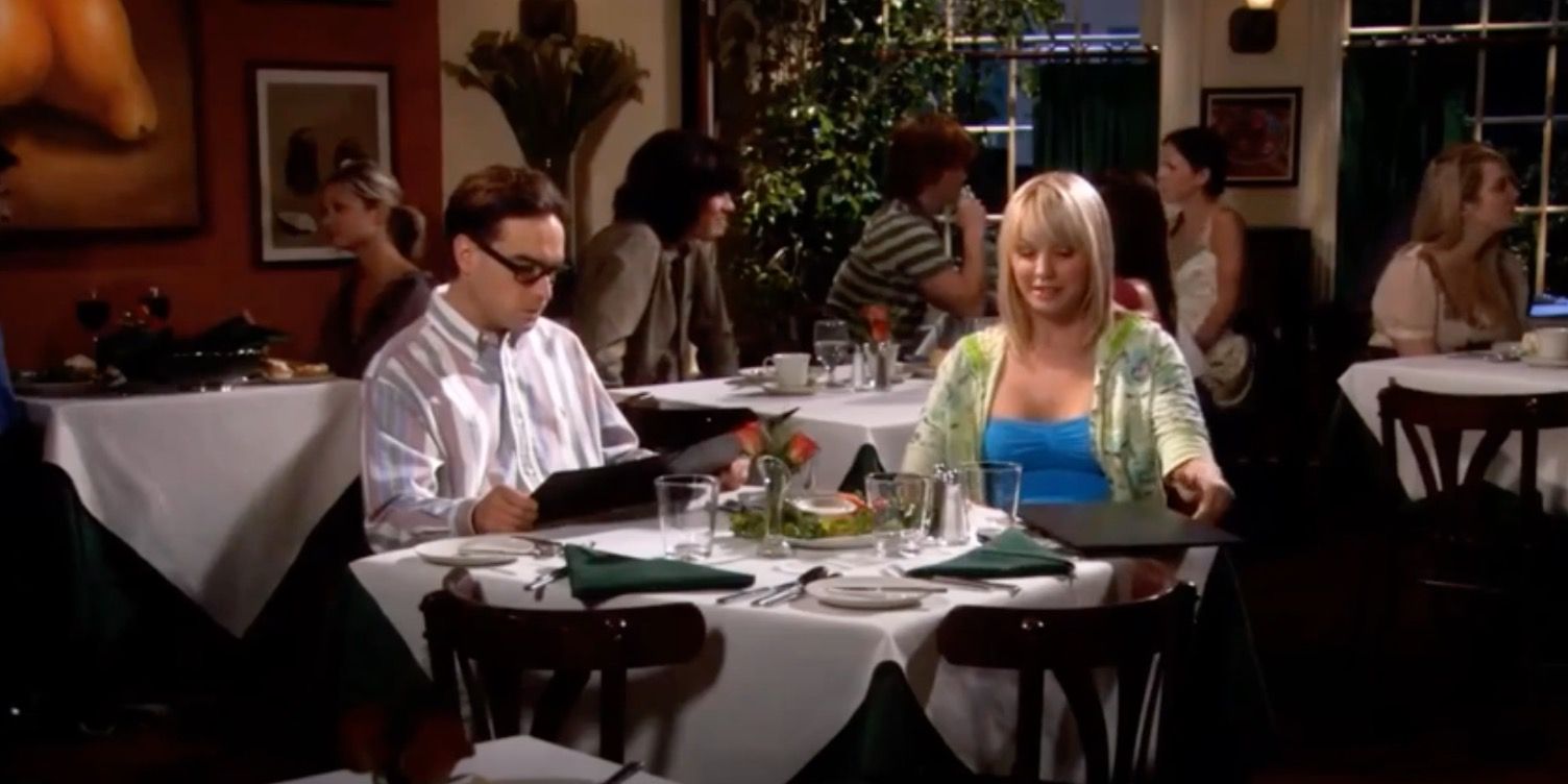 Penny sitting down with Leonard at a restaurant for an unofficial date.