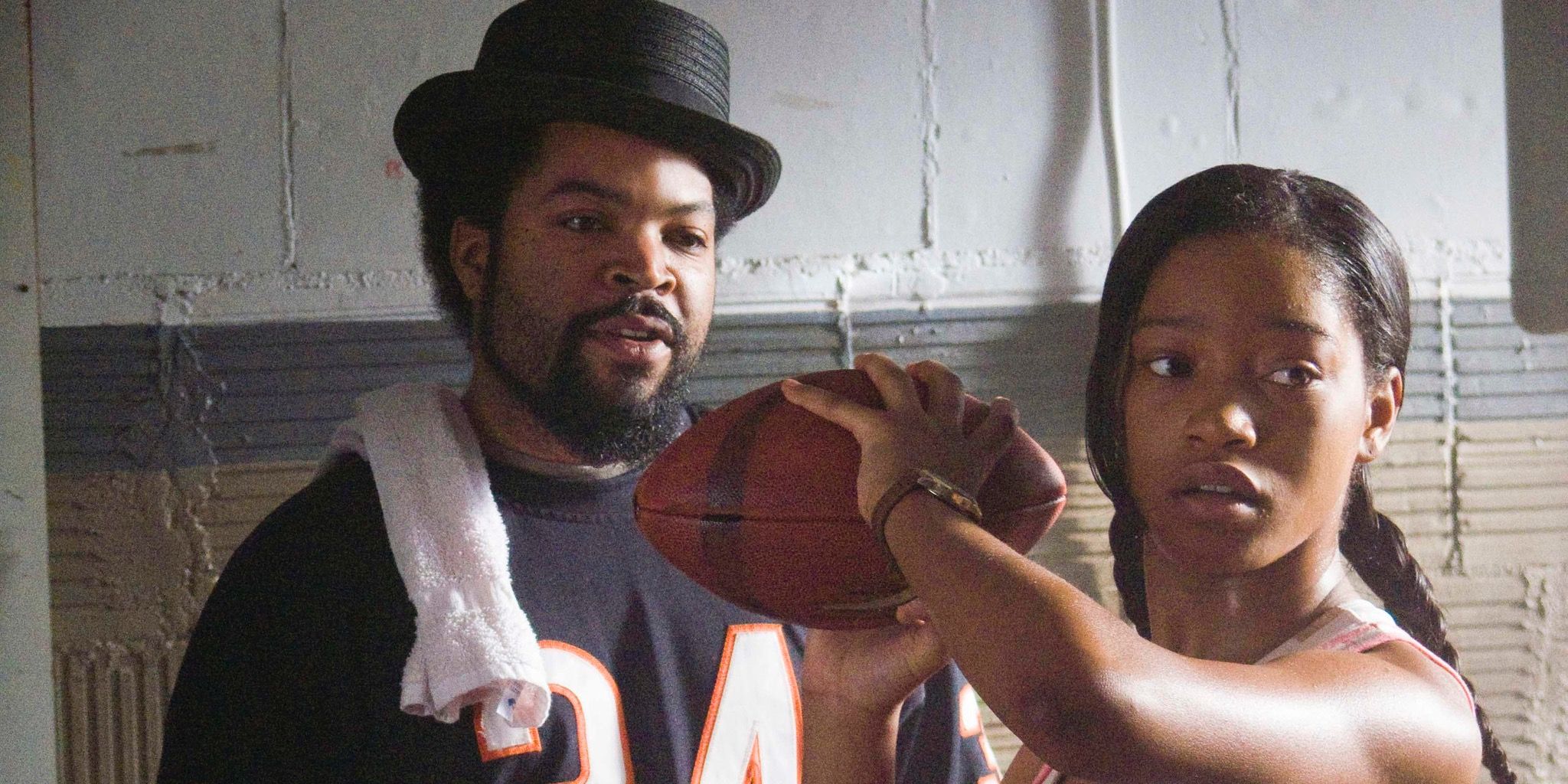 Keke Palmer throw a football next to Ice Cube in The Longshots movie