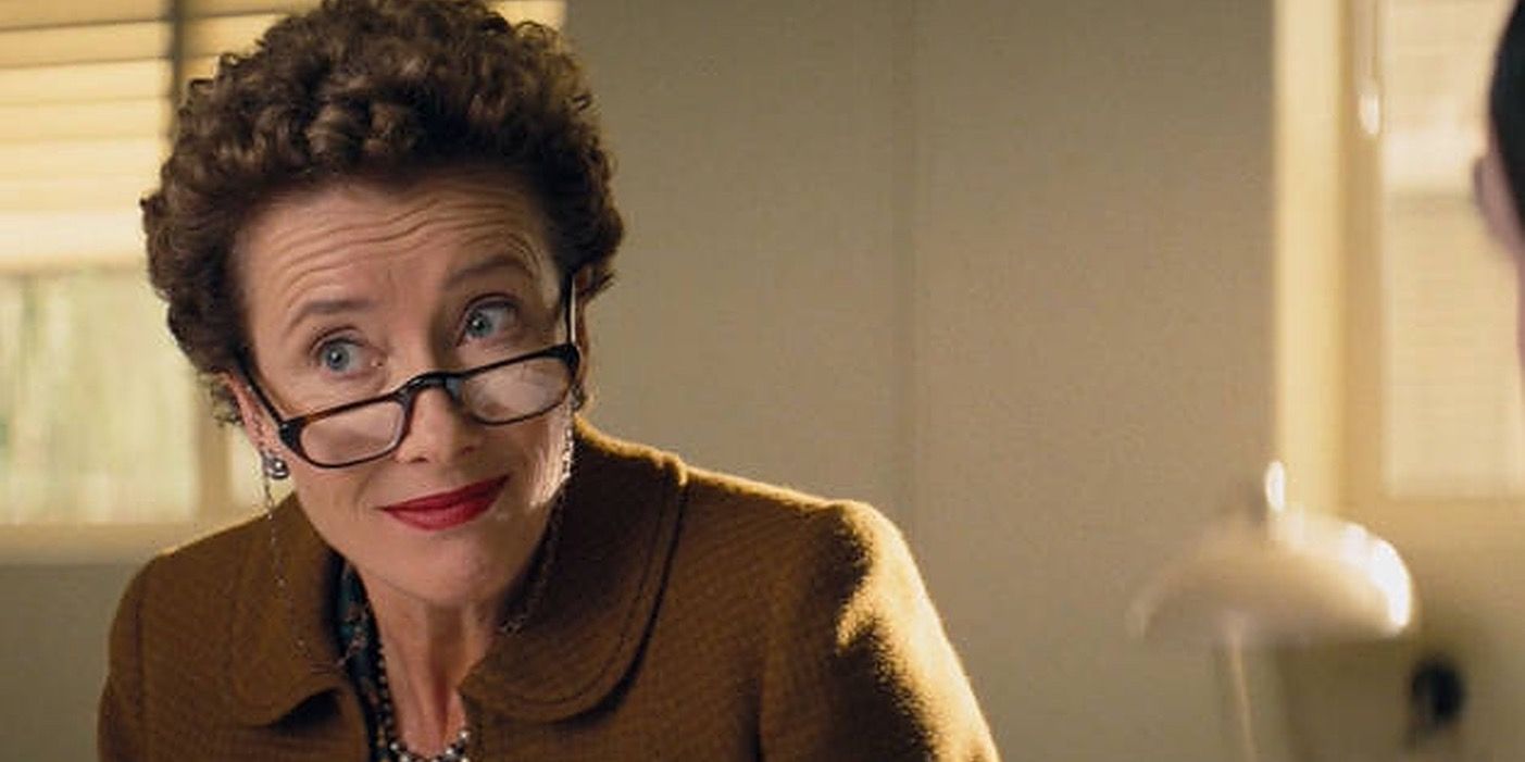 Emma Thompson wearing glasses and brown blazer in Saving Mr Banks