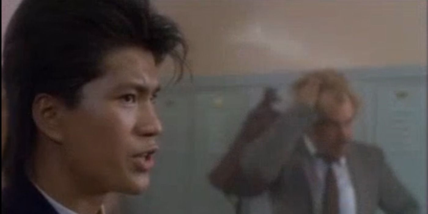 Ioki talking with a man in the background in 21 Jump Street