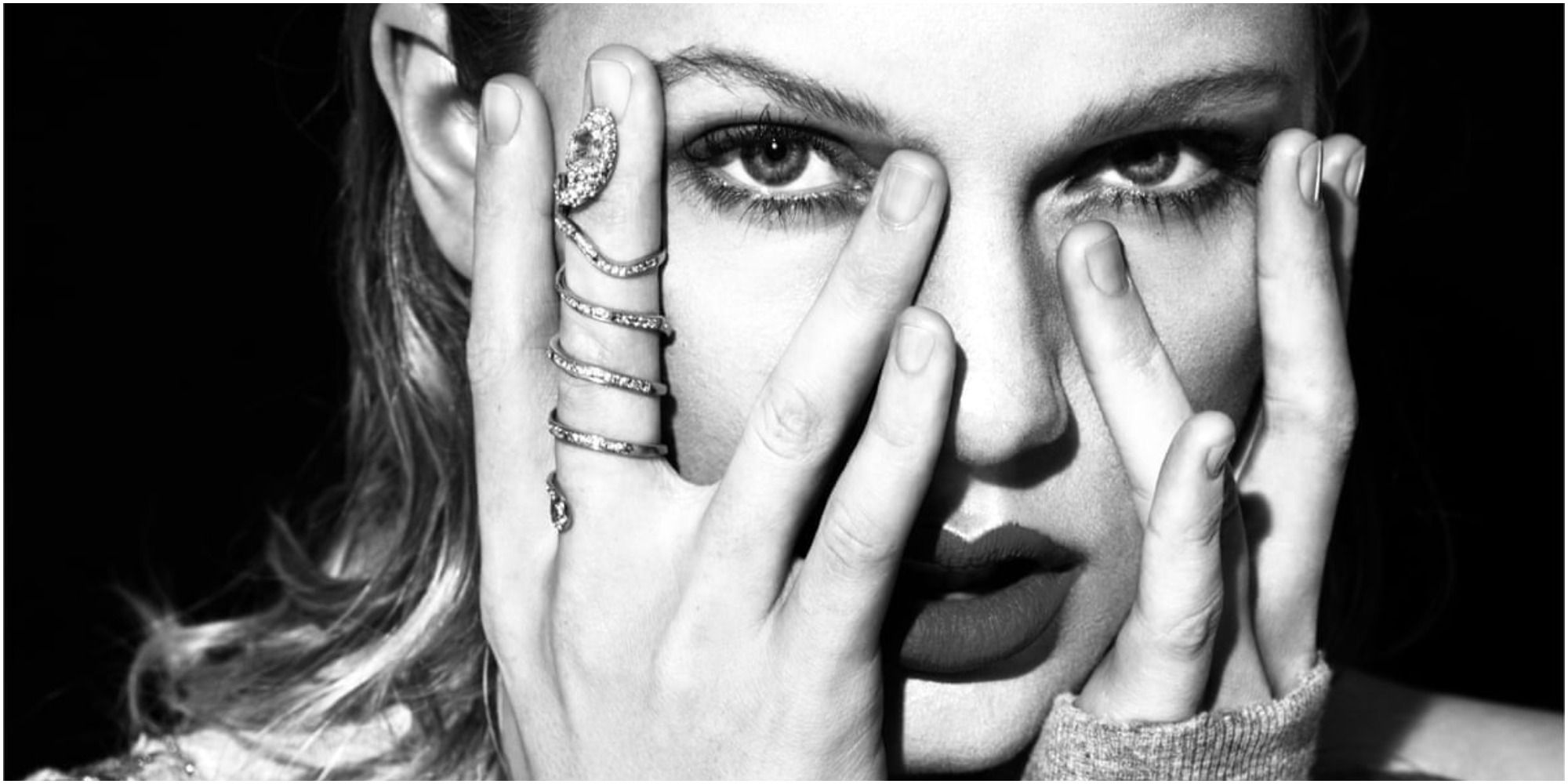 taylor swift holding her face in reputation promo image
