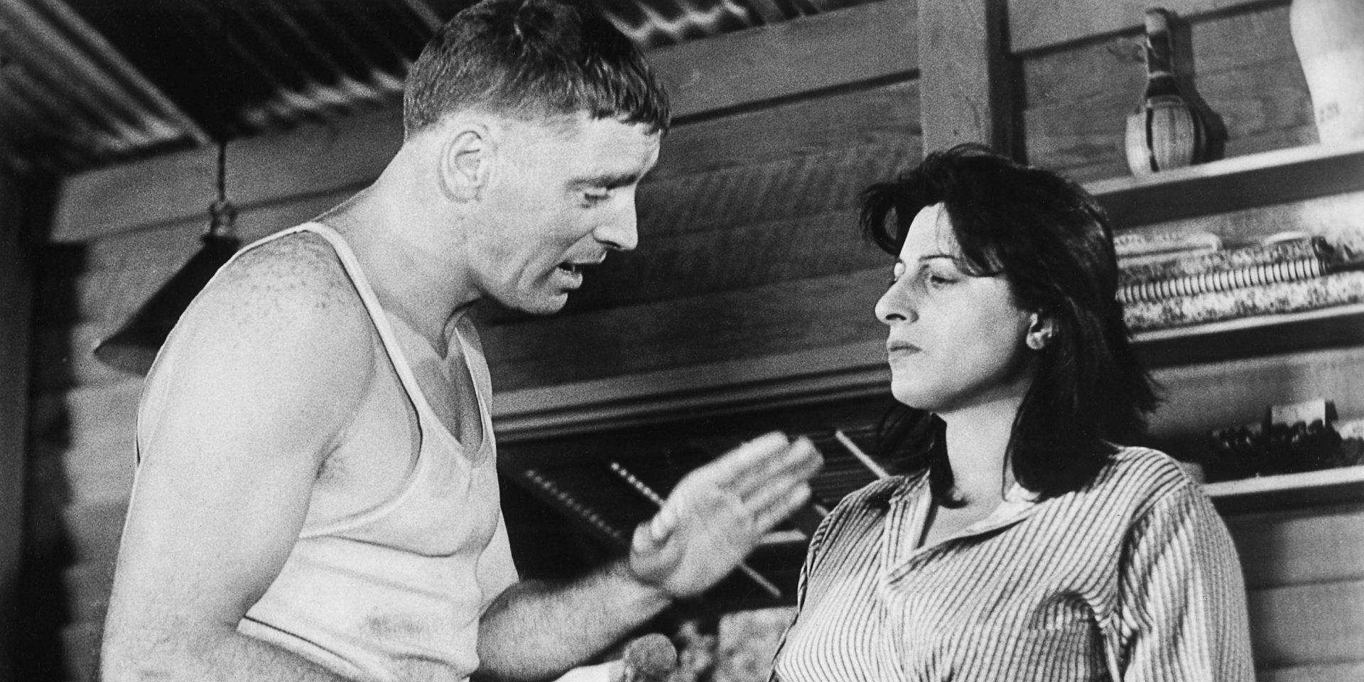 A man speaking to a woman in The Rose Tattoo