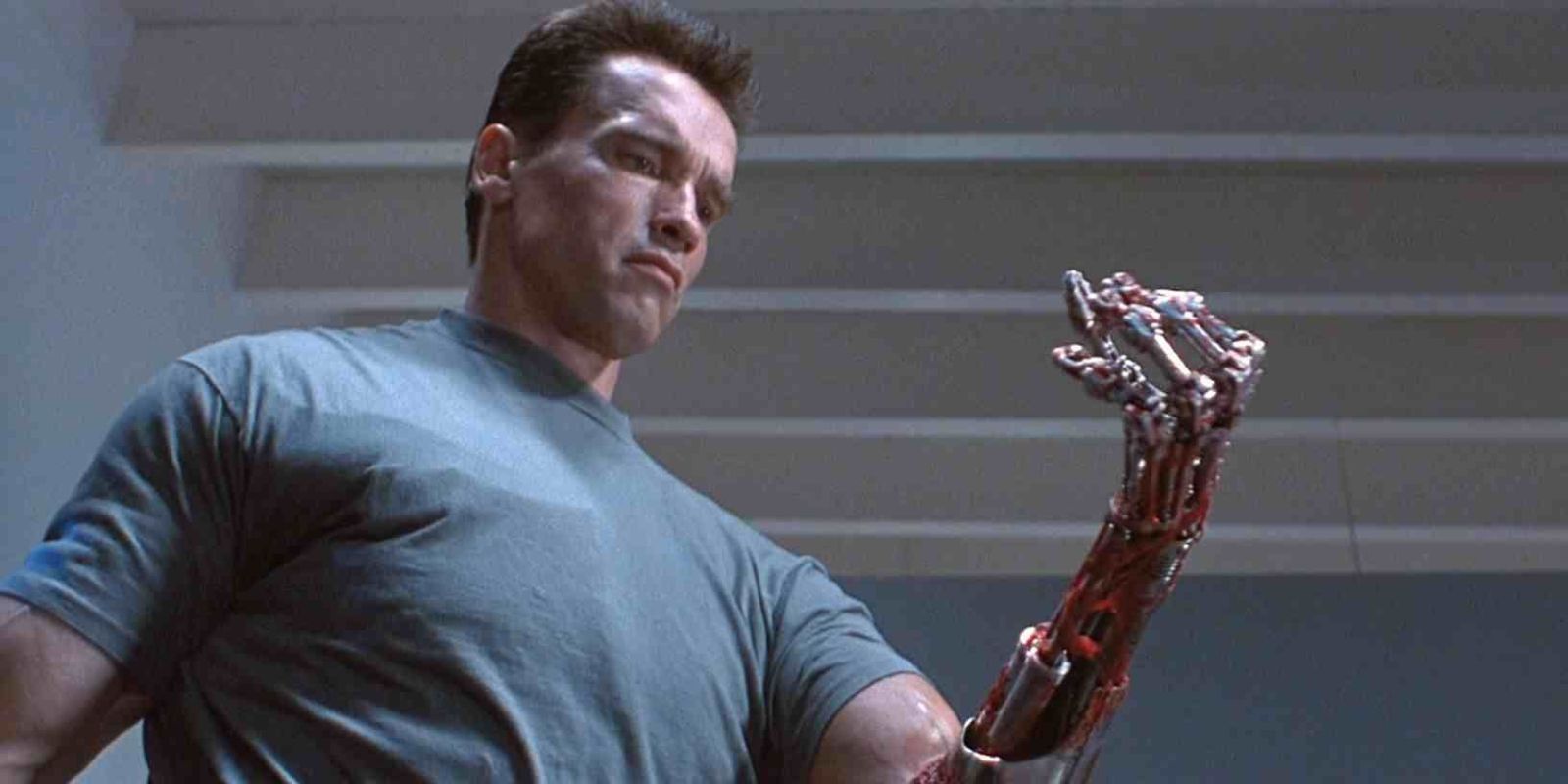 The T-800 looking at his robotic arm in Terminator 2: Judgement Day