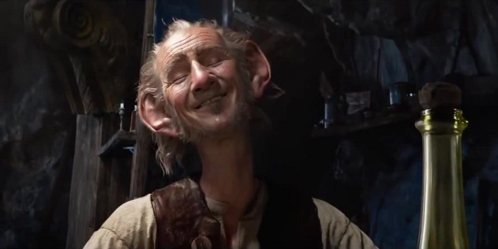 The BFG sits by bottle of Frobscotlle in The BFG
