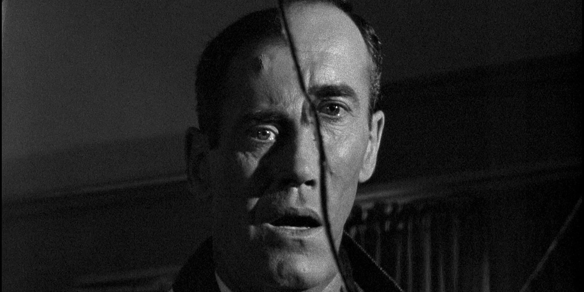 Henry Fonda looking in cracked mirror in The Wrong Man