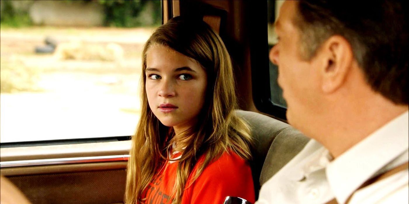 Missy looking at her dad from the passenger seat of the car in Young Sheldon.