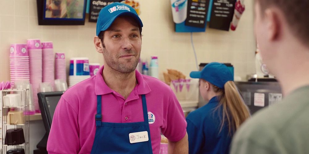 Scott where’s a pink polo and blue apron while working at Baskin Robbins in Ant-Man