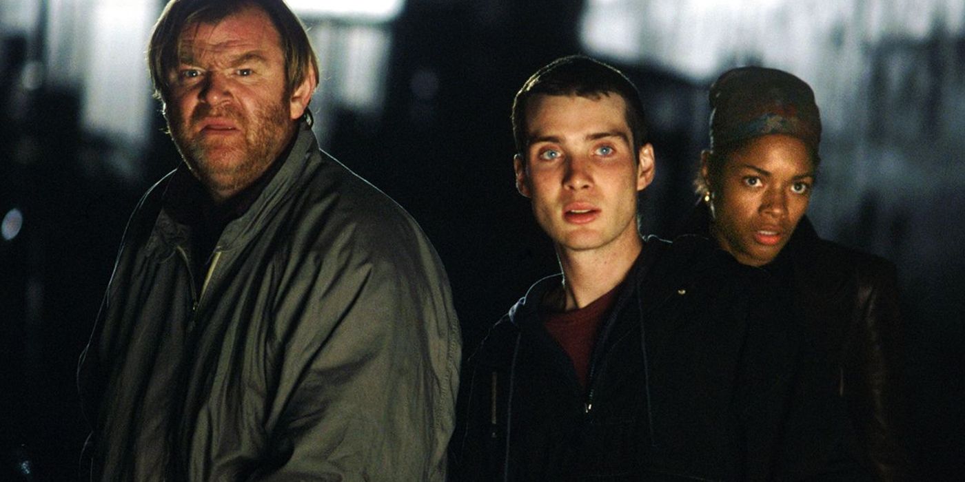 Two men and a woman look on in confusion in 28 Days Later.