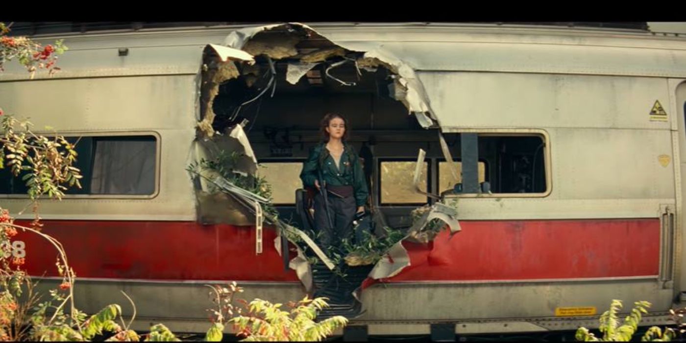 Regan stands inside a destroyed train in A Quiet Place 2