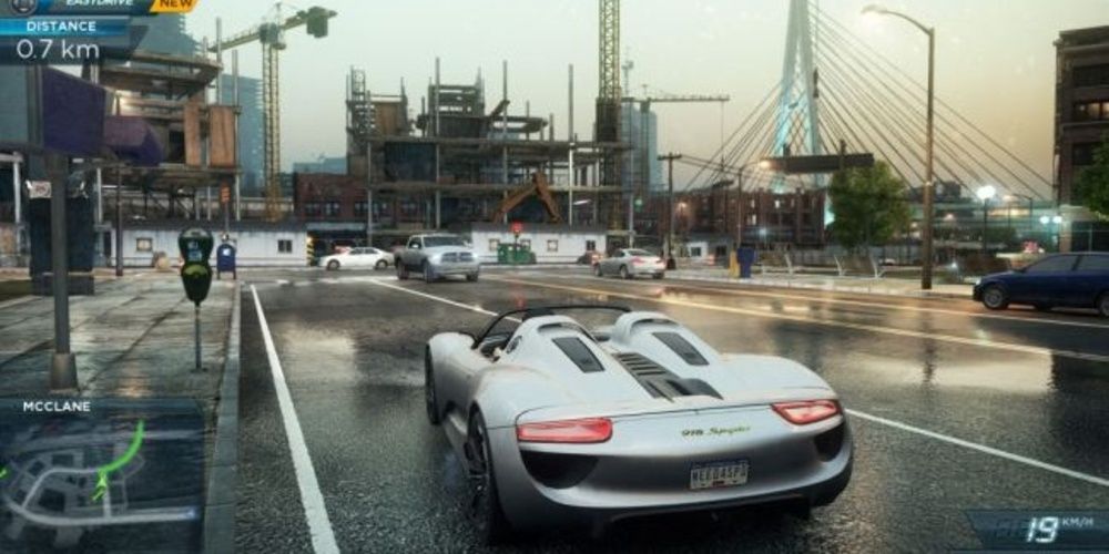 A race car is on the road in the rain in Need For Speed Most Wanted