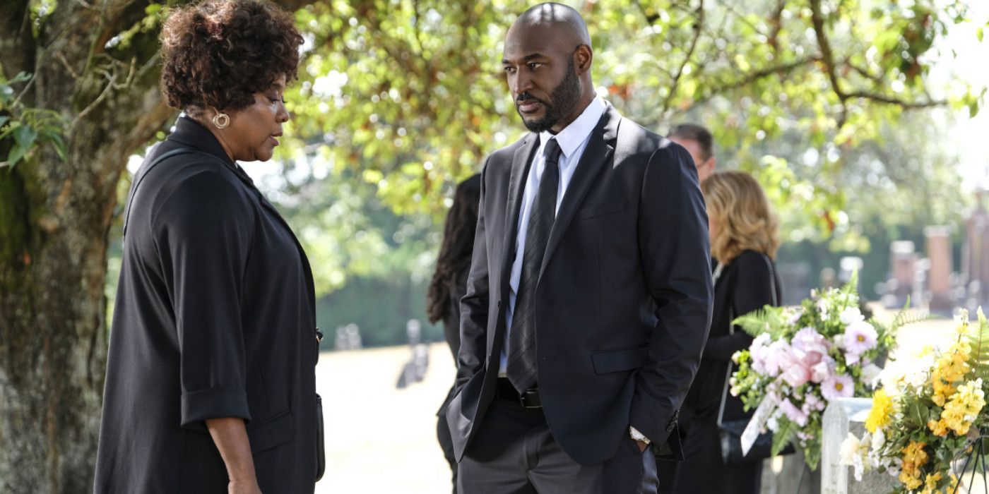 Adrian Holmes as James Moseley and Loretta Devine as Missouri Moseley at a cemetery in Supernatural