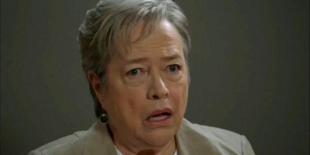 Agnes Winstead being interviewed with a shocked look on her face in AHS
