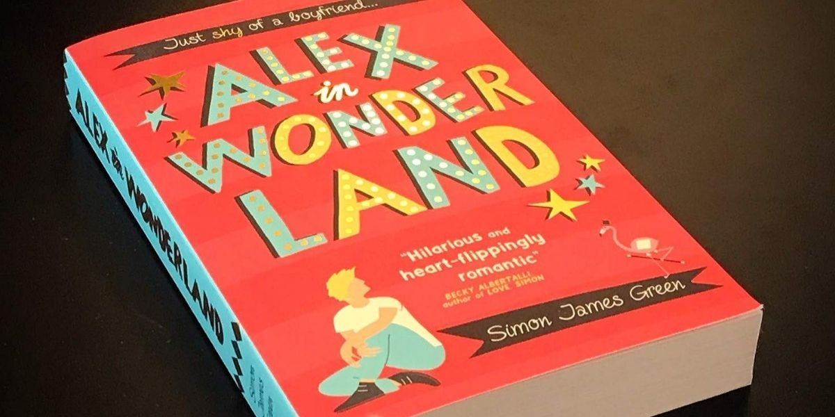 The book Alex in Wonderland on a table