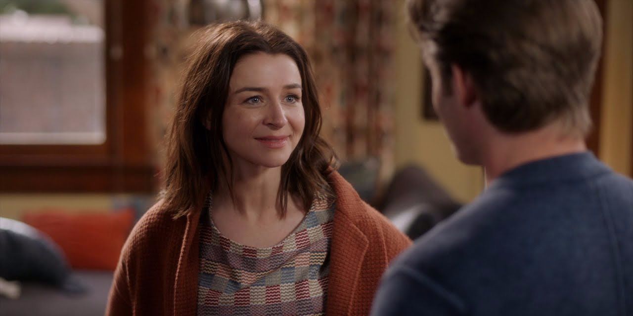Amelia smiling at Link looking tired