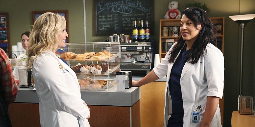 An image of Callie and Arizona having a conversation in front of the coffee cart