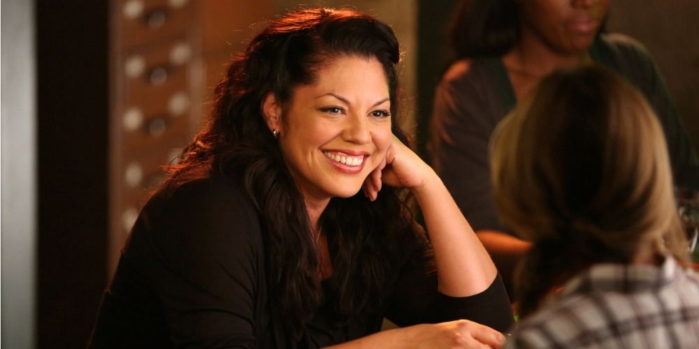 An image of Callie smiling at Meredith as the two sit at Joe&rsquo;s Bar in Grey&rsquo;s Anatomy