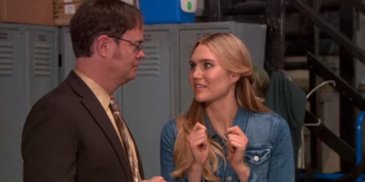 An image of Dwight and Esther standing in the warehouse in The Office