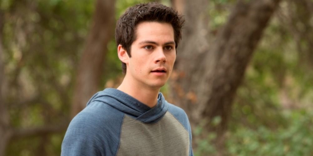 Stiles standing in a forest in Teen Wolf
