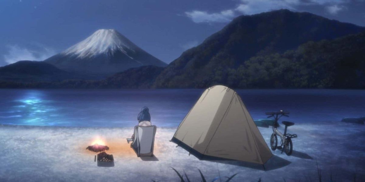 Rin sits alone at her campsite, with an excellent view of Mt. Fuji.