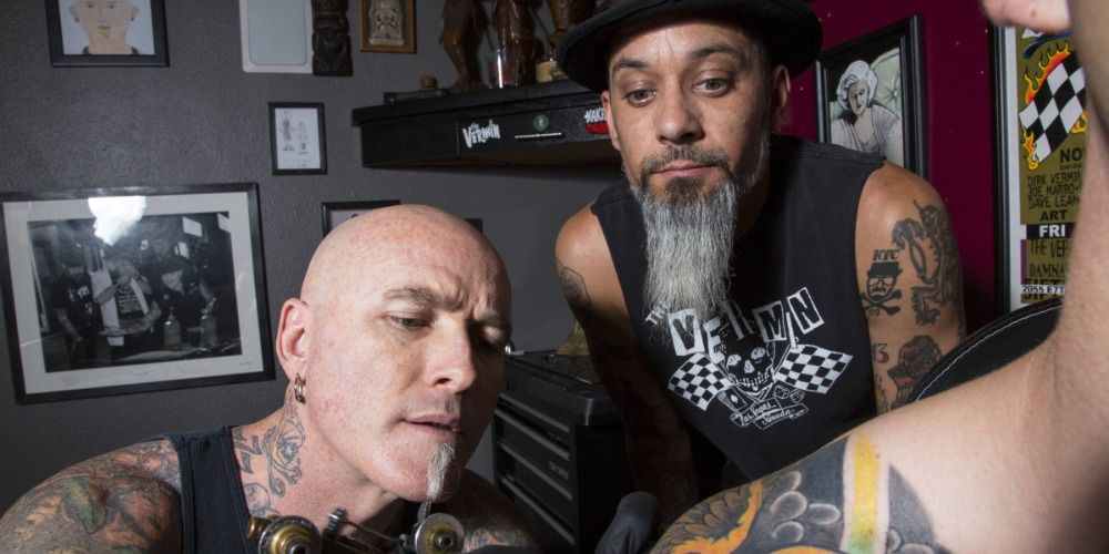 Rob Ruckus and Dirk Vermin looking at a tattoo in Bad Ink