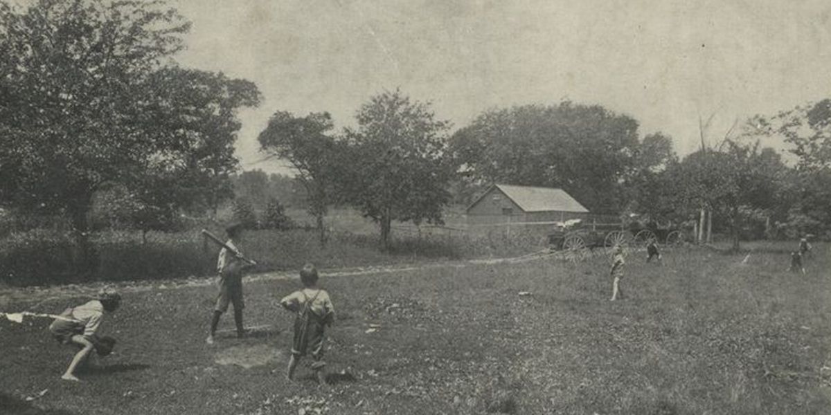 Black and white photo of kids playing baseball in PBS Baseball doc.