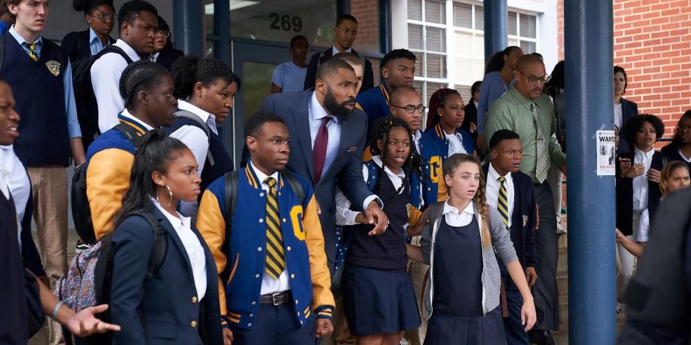 Group of school children outside the school looking shocked in Black Lightning