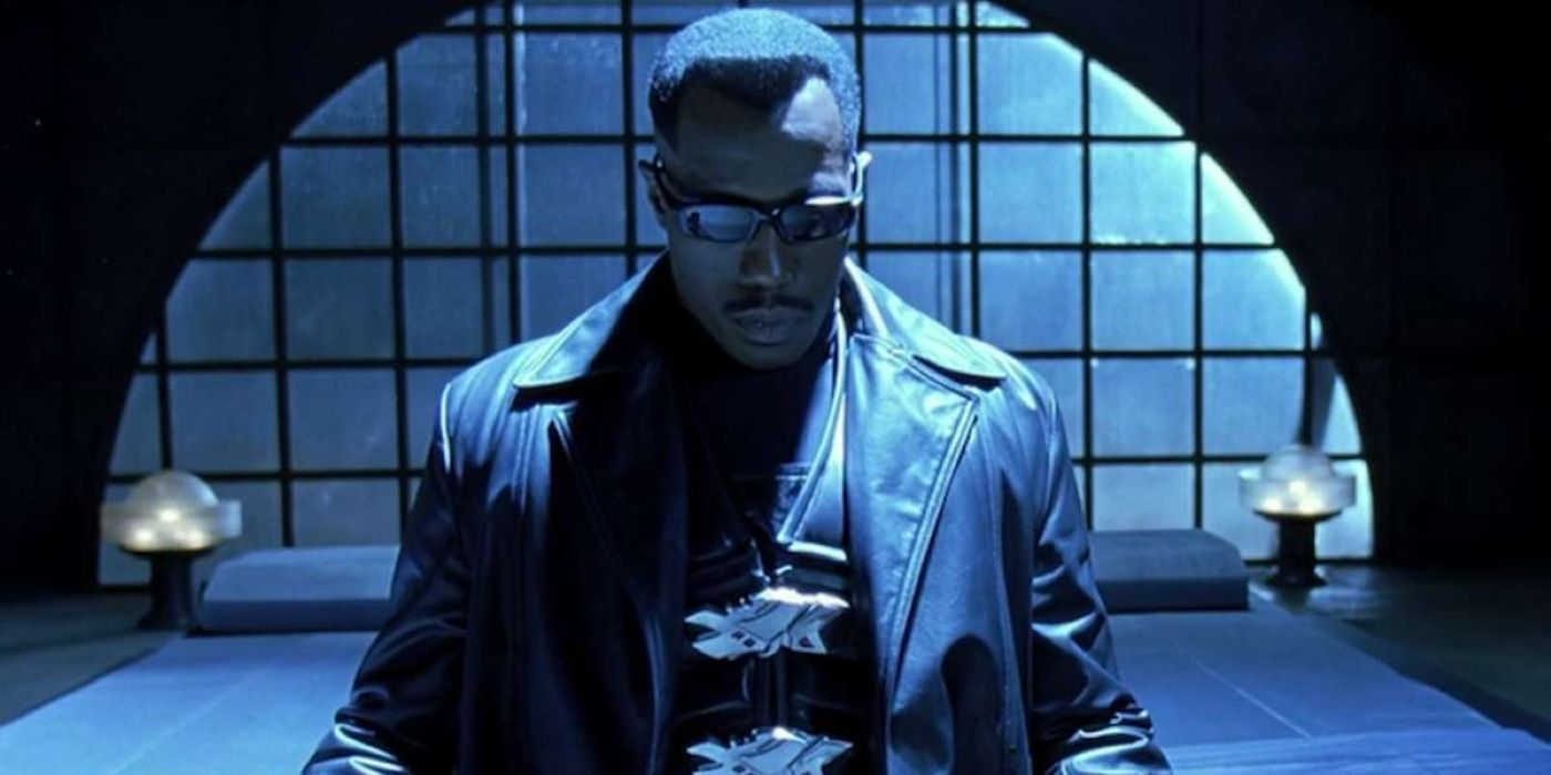 Blade standing alone in an empty room in Blade (1998).
